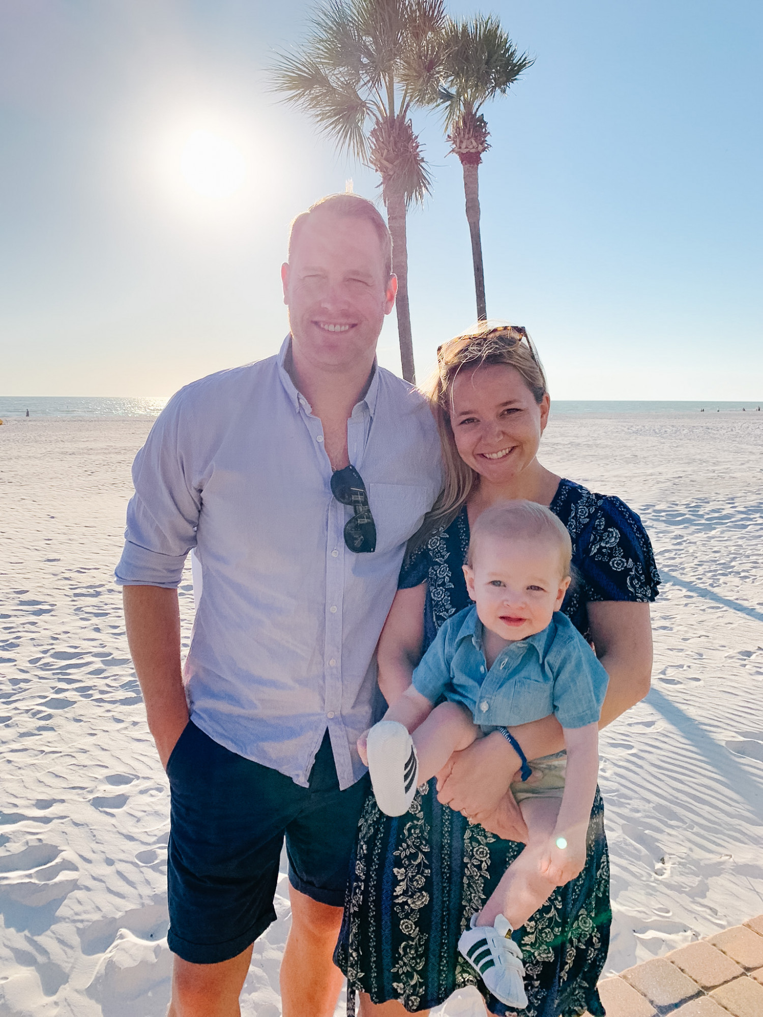 husband, wife, and baby boy on st pete beach traveling
