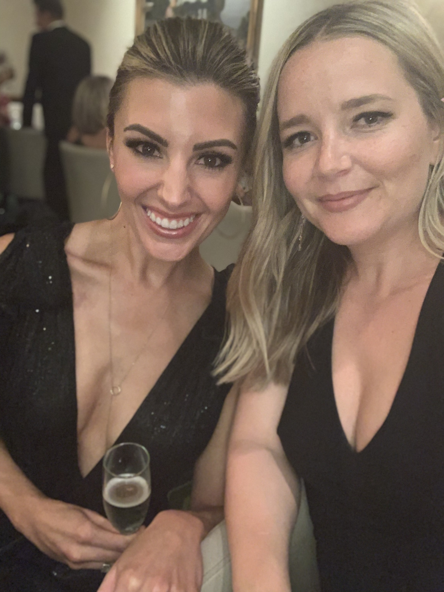 two women at a black tie wedding